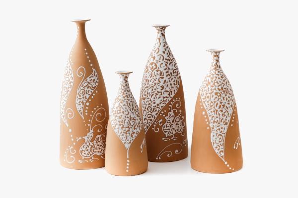 Doriana Usai White relief bottles